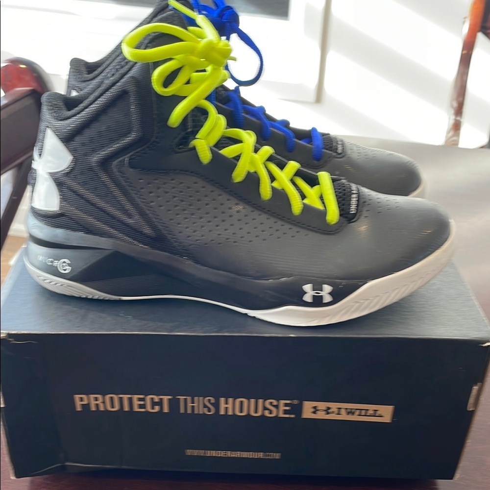 Under Armour Black Woman’s basketball shoes.